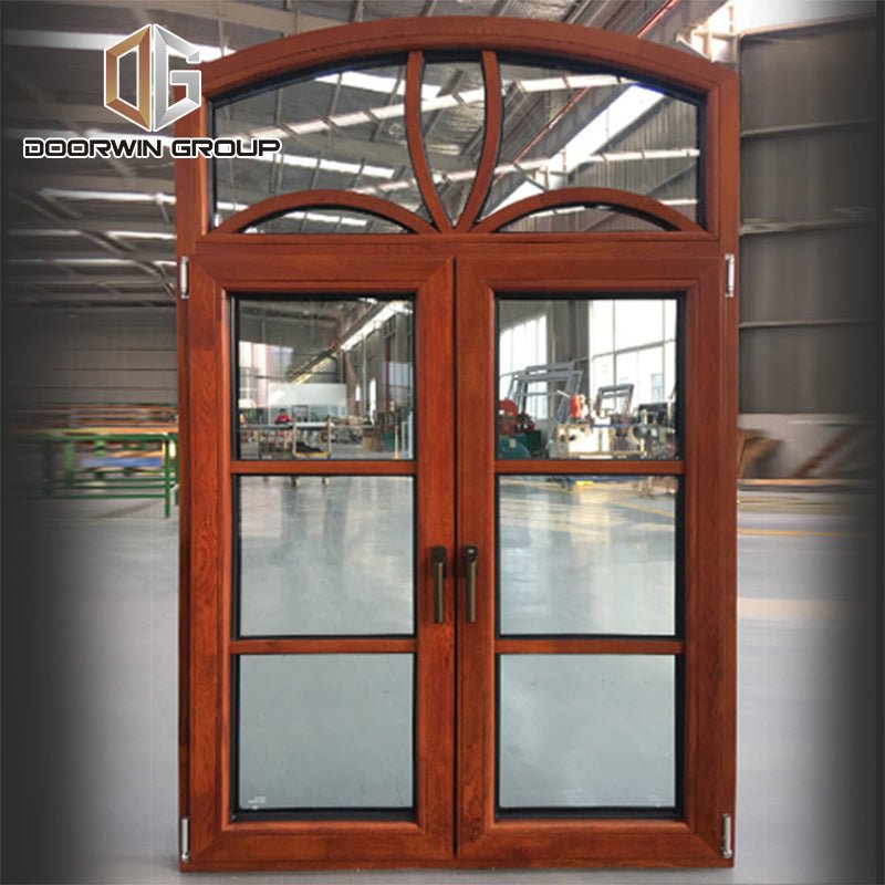 Arched thermal break aluminum window with oak wood cladding from inside, casement French window with grill design - Doorwin Group Windows & Doors
