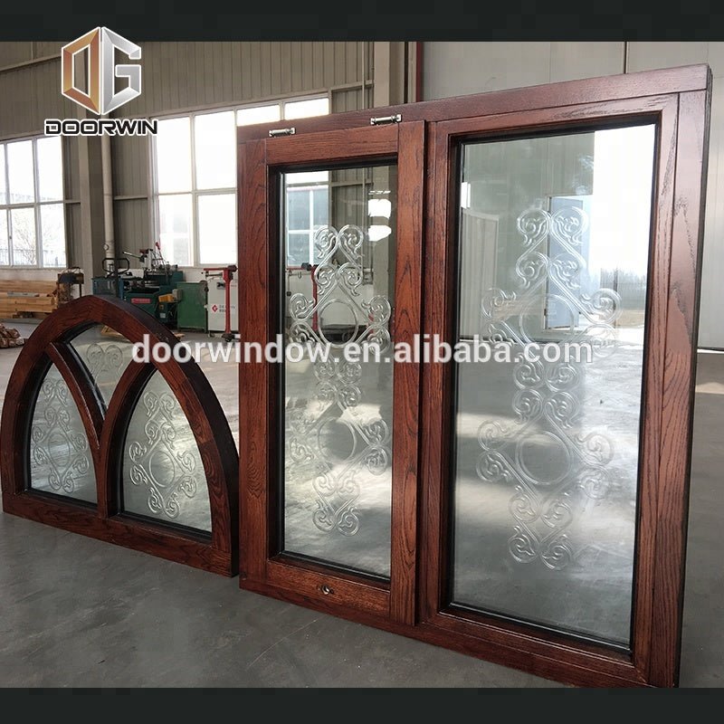 Fantastic arched oak wood window frame with carved glass for houseby Doorwin - Doorwin Group Windows & Doors