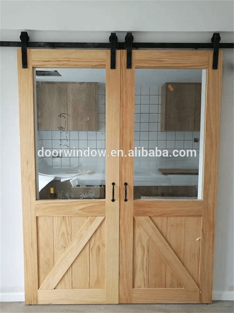 Interior wood partition design glass insert wooden barn door by Doorwin - Doorwin Group Windows & Doors
