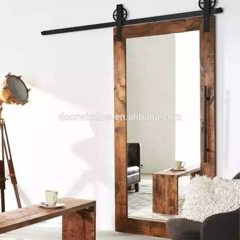 Marriott Hotel Bathroom Barn Door with Mirror by Doorwin - Doorwin Group Windows & Doors