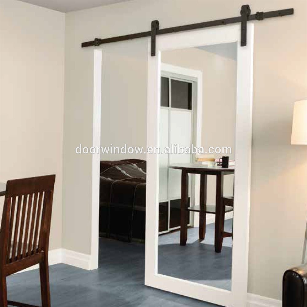 Marriott Hotel Bathroom Barn Door with Mirror by Doorwin - Doorwin Group Windows & Doors