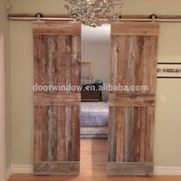 Movable plank panel wooden doors design catalogue surface stained sliding barn door for partition by Doorwin - Doorwin Group Windows & Doors