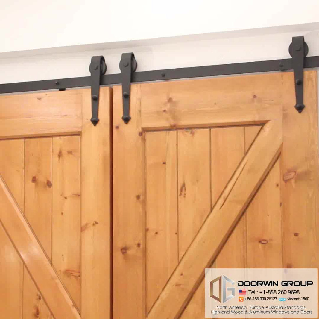 Movable plank panel wooden doors design catalogue surface stained sliding barn door for partition by Doorwin - Doorwin Group Windows & Doors