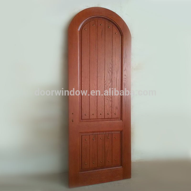 Round top design interior solid red oak wood door with copper nail by Doorwin - Doorwin Group Windows & Doors