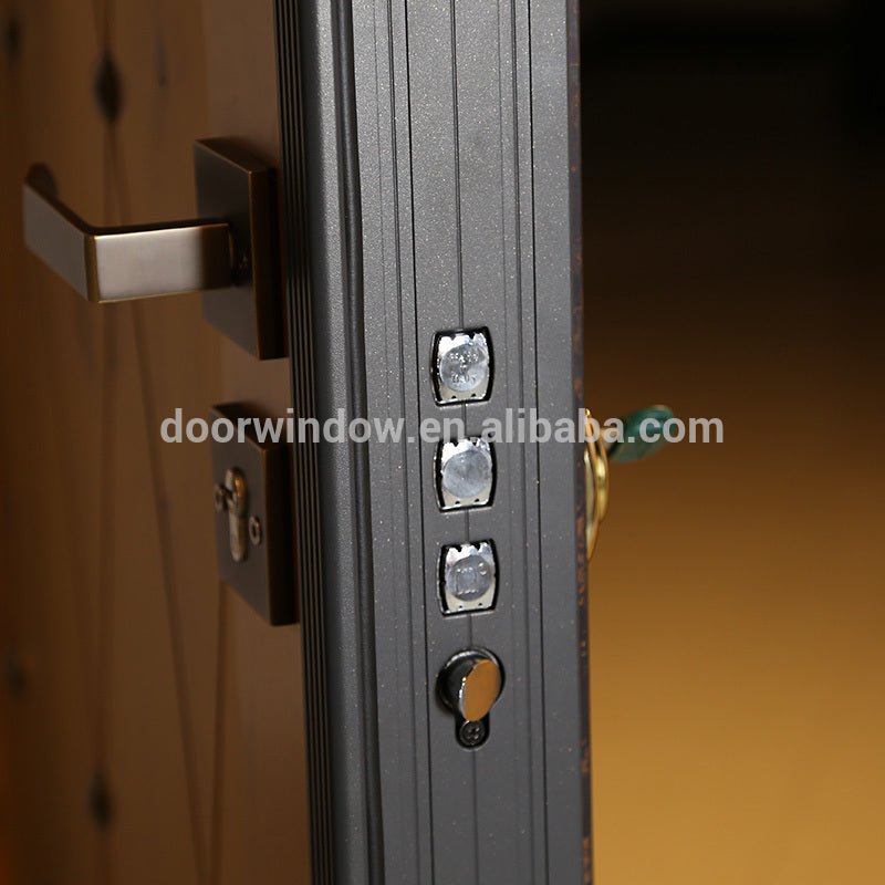 security doors homes exterior panel door design knotty alder wood door with copper tack decoration steel framed by Doorwin - Doorwin Group Windows & Doors
