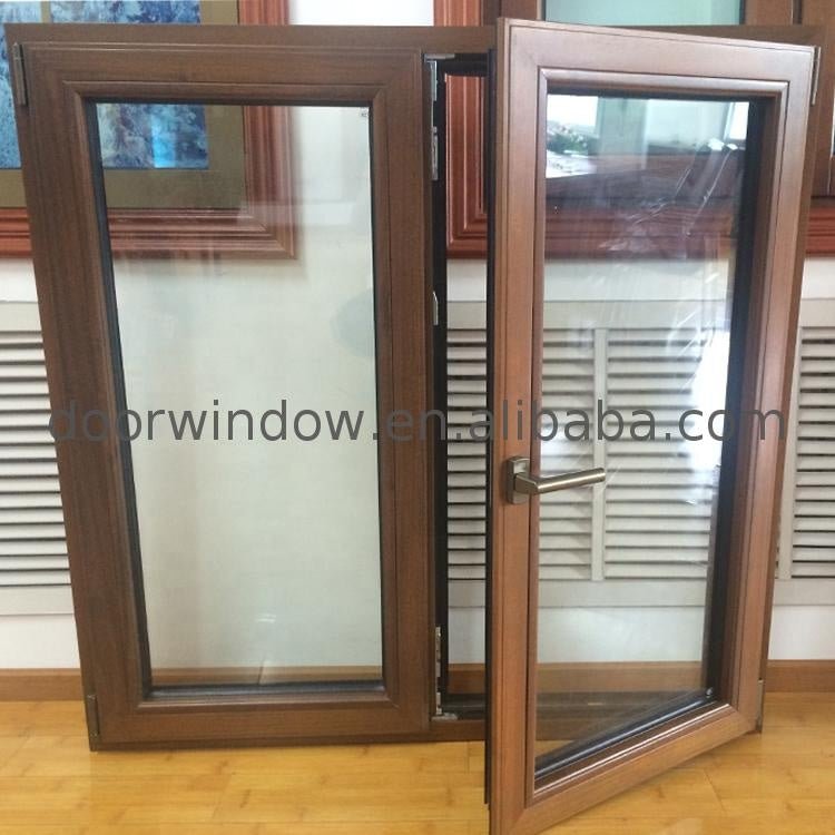 Teak wood and aluminum French style casement window with grill design - Doorwin Group Windows & Doors