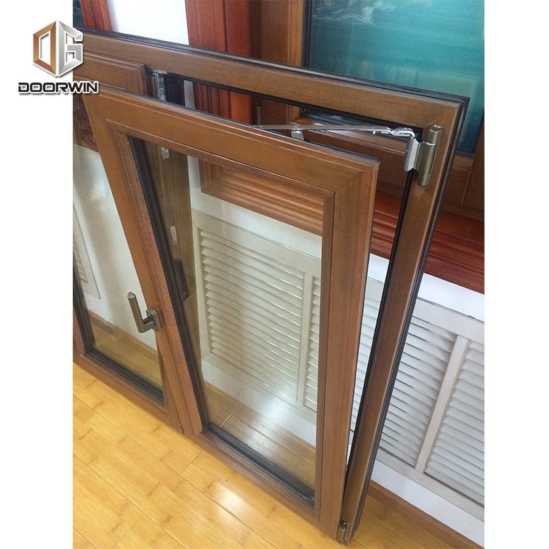 Teak wood and aluminum French style casement window with grill design - Doorwin Group Windows & Doors