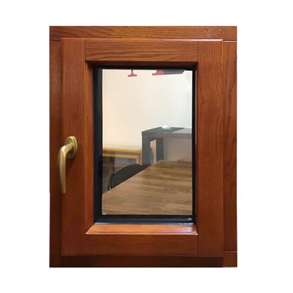 tilt turn window-33 oak wood window with exterior aluminum cladding fitted with hidden hinges - Doorwin Group Windows & Doors